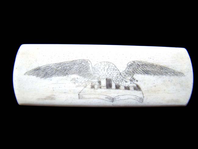 A late 19th century Whalebone brush with scrimshaw eagle and shield